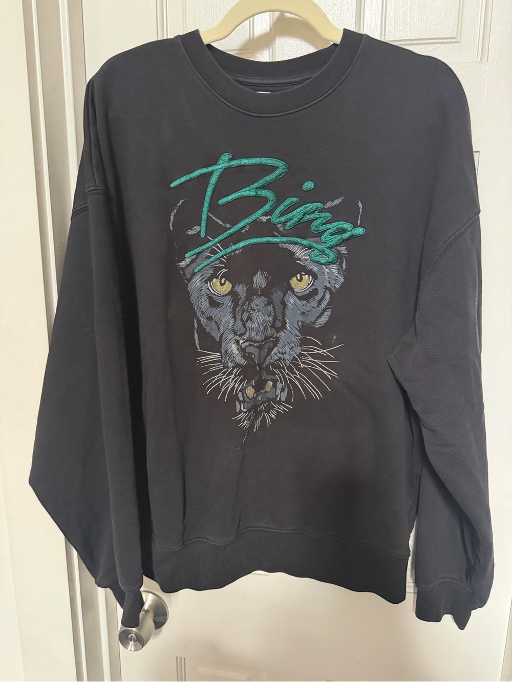 Anine Bing Black Crewneck Sweatshirt with Teal Script and Yellow Eye Accents